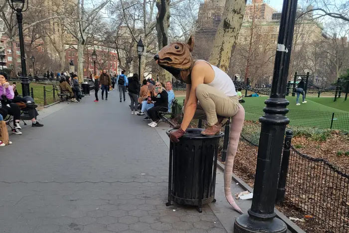 a person in a rat costume in Washington Square Park